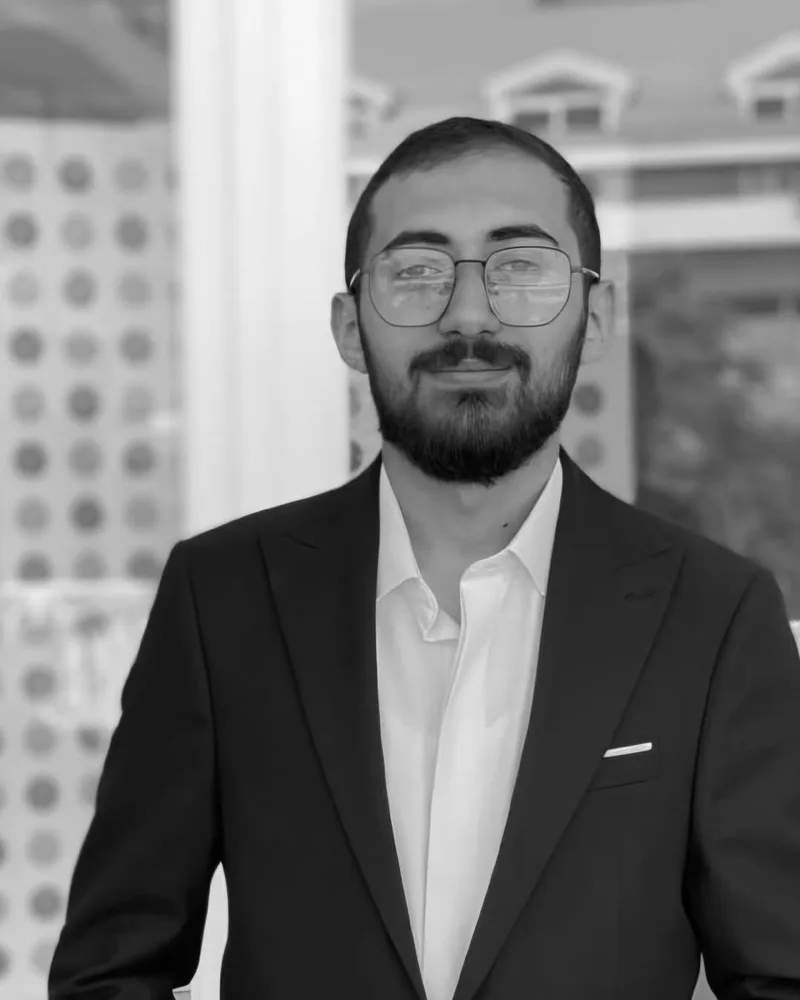 Hadi Moustafa, software engineer and digital marketer, in a dark suit and glasses